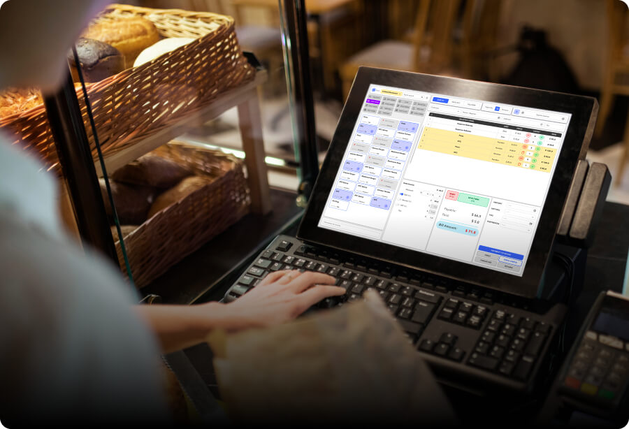 A cashier taking restaurant orders using a console