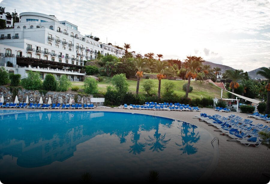 A man at the reception counter of a hotel